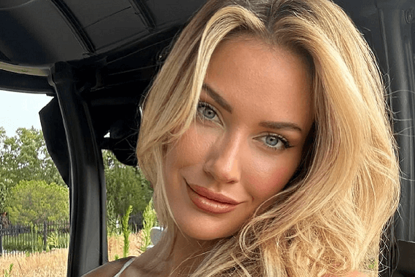 A stunning photo show braless Paige Spiranac leaning over and tease fans while she is on golf course